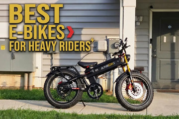Black Aniioki A9 Pro Max fat tire ebike with gold front suspension fork parked outside a suburban residential house