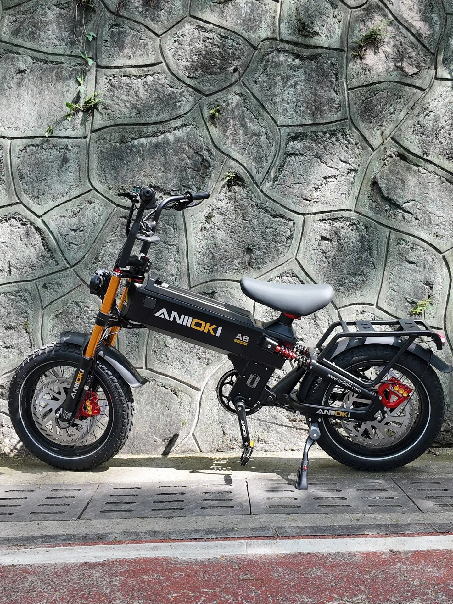 Side profile of the Aniioki A8 Pro Max 52V dual motor AWD ebike, a high performance e-bike designed for off-road adventures and heavy riders.