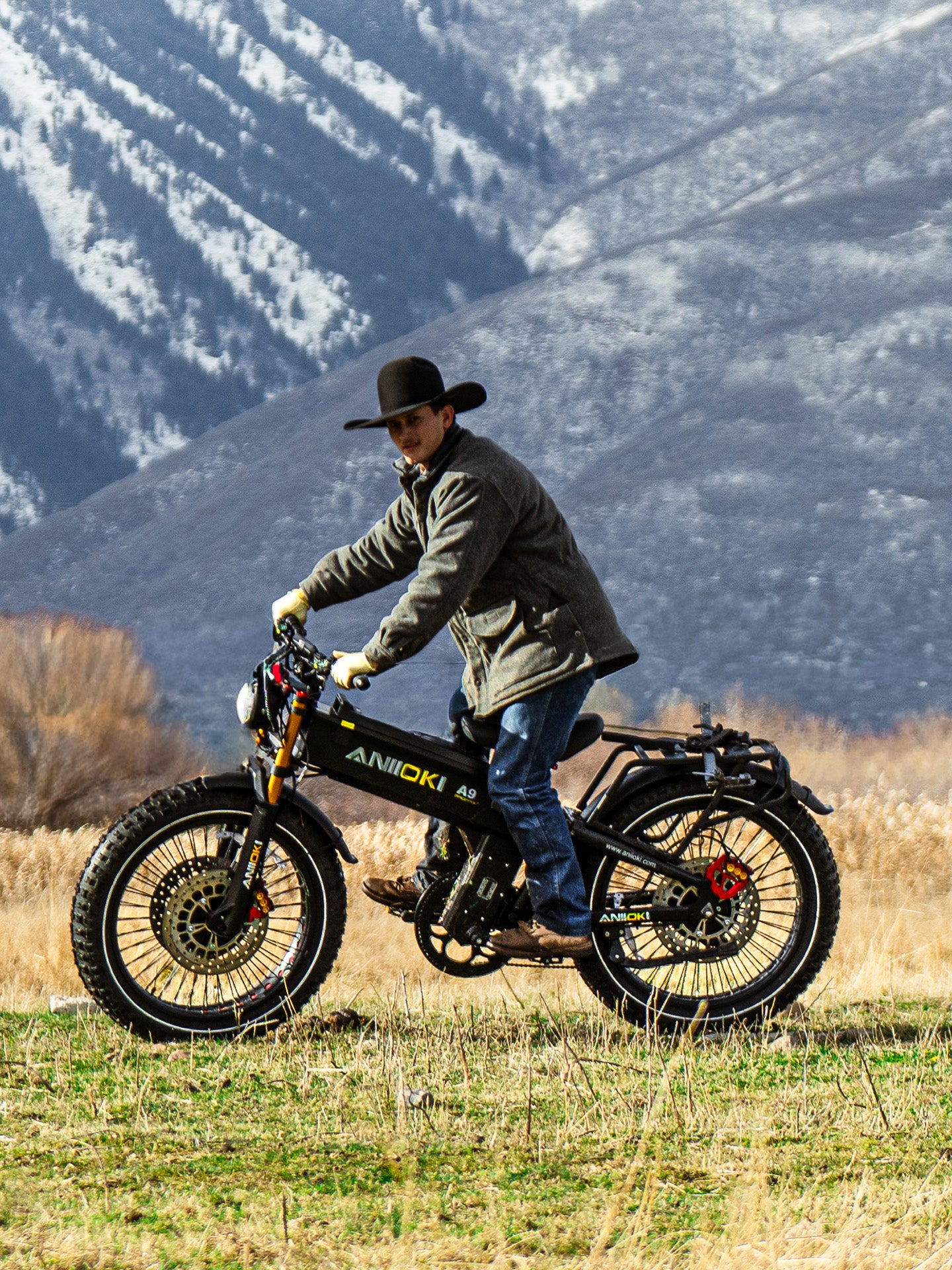 A rider on the Aniioki A9 Pro Max exploring open fields, highlighting its suitability for long-range outdoor adventures.