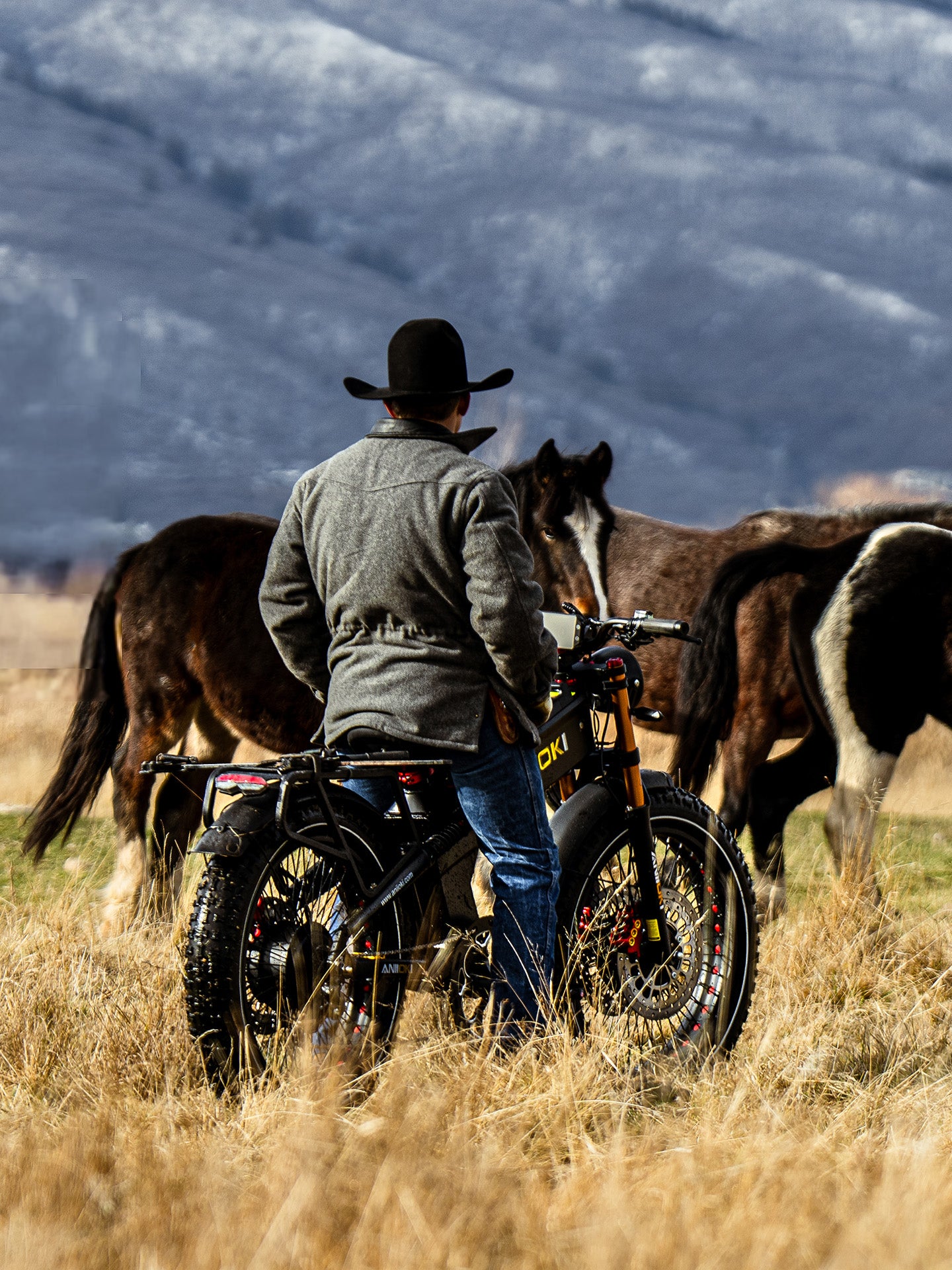 The powerful Aniioki A9 Pro Max parked at a ranch with horses, emphasizing a rugged, "Go Faster, Wilder, Further" lifestyle.