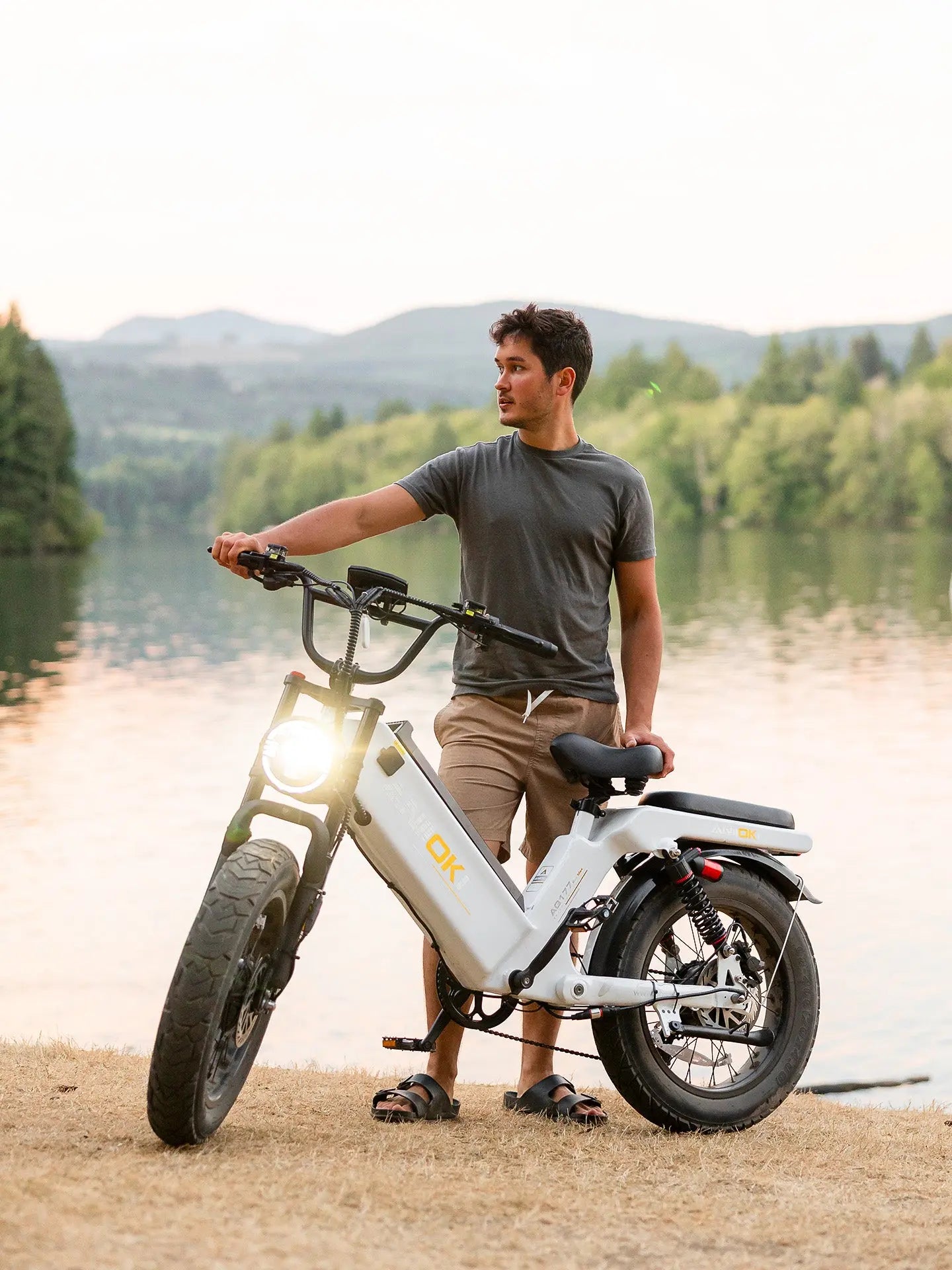 A scenic lakeside view of the aniioki aq177 pro max dual motor. This best budget high-speed e-bike combines style with performance, featuring an ebike with hydraulic disc brakes for precision control and safety