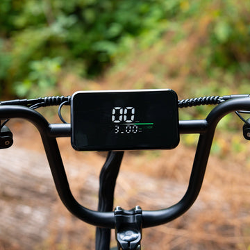 Digital LCD display screen mounted on the handlebars of the Aniioki AQ177 60V long range ebike, showing real-time speed and battery status readout.