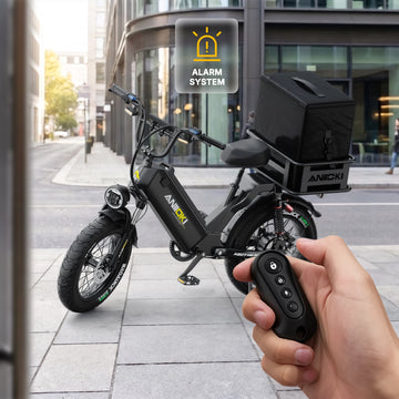 Anti-theft alarm system and remote control for the black Aniioki AQ177 60V delivery ebike, parked on a city street with a rear insulated cargo box.